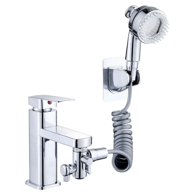 Faucet shower kit with handheld shower head, coiled hose and wall holder connected to a basin faucet